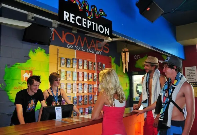 Reception and bar area at Nomads Serpents hostel in Cairns after refurbishment painting